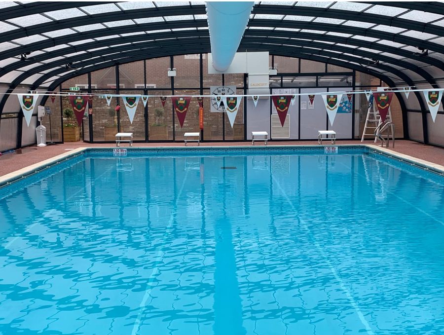 School indoor pool with team pennants