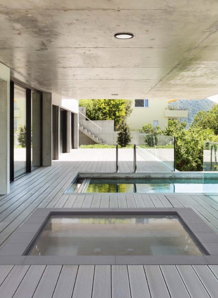 Couple enjoying cocktail pool under pergola